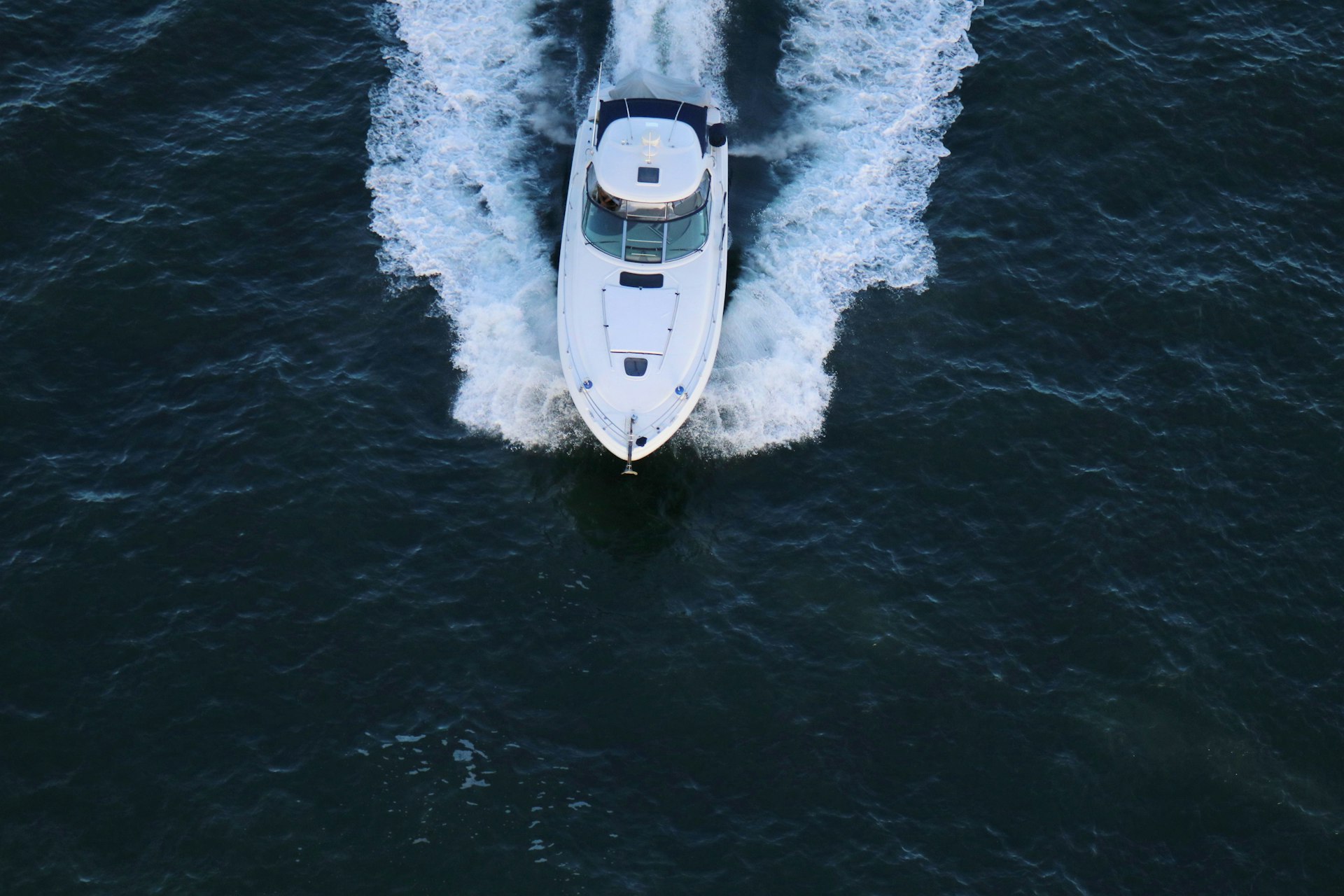 Aerial view of a motor vessel underway on open water