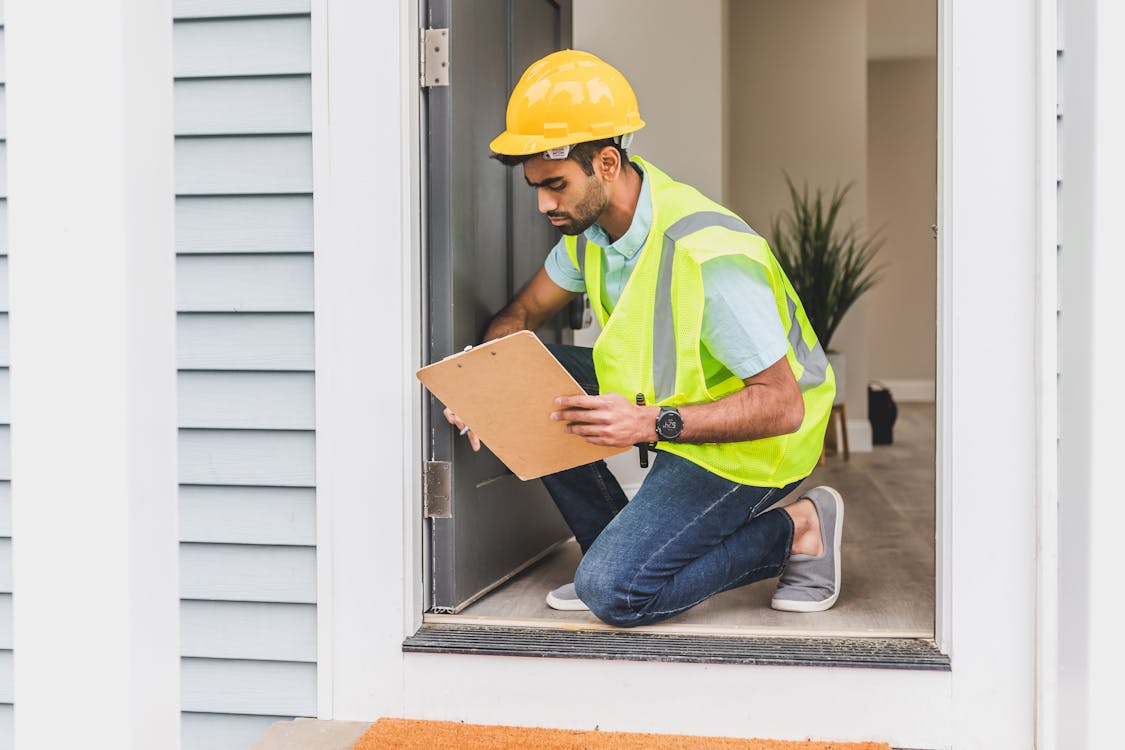 Inspector with clipboard performing a condition assessment